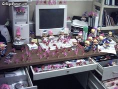 a desk with many toy figurines on it