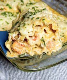 a casserole dish with shrimp, cheese and broccoli