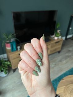 Fall Nails Green Almond, Almond Shaped Olive Green Nails, Sage Leaf Nails, Sage Green French Tip Nails Almond Short, French Tip With Leaf Design, Nails Floral Simple, Sage Green Nails With Heart, Sage Green Nails With Leaf Design, Pale Green Nails With Flowers