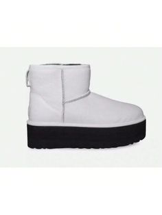 Elevate your shoe game with these UGG Women's Classic Mini Platform Boots in white. These boots feature a round toe shape and a pull-on closure for ease of wear. The boots are made with a blended fabric upper material and a rubber outsole material for durability. 

The shoes have a mid-calf shaft style and a 2-inch platform height for added comfort. The calf width is regular, and the shoes come in a standard shoe width. The boots are lined with sheepskin and insulated with wool, making them perf White Shoes Women, Drop Shoulder Sweaters, Boots Women Fashion, Ugg Classic, Classic Mini, Womens Boots Ankle, Platform Boots, Womens Uggs, Shoe Game