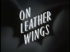 a neon sign that says on leather wings with the bat logo in white and black