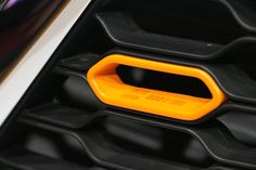 an orange and black object sitting on top of a table