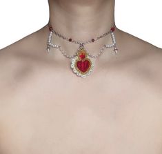 Queen of Hearts Choker ♥️  Step into a world of whimsy and elegance with the enchanting Queen of Hearts Choker, a fairytale accessory that will transport you to the enchanting realm of Alice's Adventures in Wonderland. ♥️  This captivating choker is meticulously crafted from high-quality materials, including silver chains, vibrant red glass beads, delicate faux pearls, and a grand acrylic crowned heart pendant. Each element is carefully chosen to evoke the iconic Queen of Hearts, the embodiment of power, passion, and a touch of madness. ♥️ Only one available as I like to make one of a kind pieces so that you have a unique, standout, rare, special piece that you can't find anywhere else. Keep your jewellery away from water, oils, perfumes and make sure to remove before showering and sleepin Queen Of Hearts Necklace, Queen Of Hearts Accessories, Descendants Dr, Fairy Tale Jewelry, Red Heart Necklace, Heart Crown, Heart Accessories, Jewelry Catalog, Pendant Choker