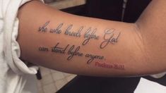 a woman with a tattoo on her arm that says, she who bleed before you can stand before anyone