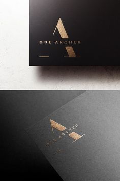 two black and gold business cards with one letter on the front, one in the middle