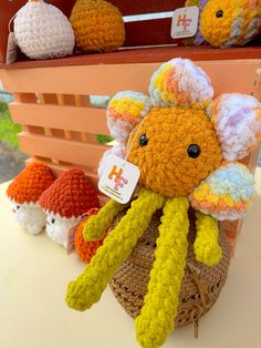 several crocheted stuffed animals are on display