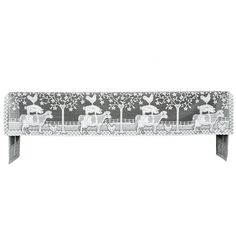 a black and white photo of a bench with horses on it's back legs