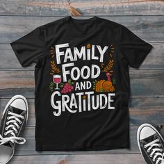 a black shirt with the words family food and gratitude on it