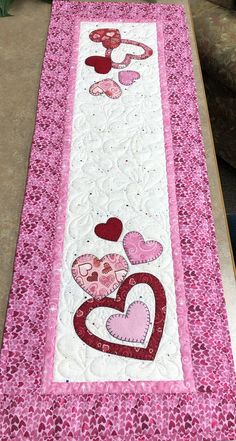 the table runner has hearts on it