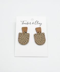 Leopard Clay Earrings, Handmade Clay Earrings, Polymer Clay Jewelry, Neutral Clay Earrings, Lightweight Clay Earrings, Statement Earrings Tan Clay Dangles with black leopard print and a wood post. Handmade earrings using high quality polymer clay and hypoallergenic posts. These earrings are comfy and lightweight, great to wear all day! They make the perfect gifts! All earrings are handmade, some variations/imperfections are possible. The earring cards are 3.5" tall and 2.5" wide for size referen Leopard Clay Earrings, Earrings Handmade Clay, Handmade Clay Earrings, Wood Post, Black Leopard Print, Earrings Polymer Clay, Earring Cards, Handmade Clay, Black Leopard