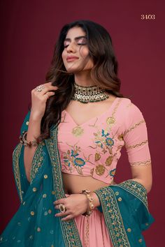 This Peach Faux Georgette Lehenga Choli Set with Dupatta is adorned with intricate Zari, Thread & Sequins Embroidery, giving it a timeless and classic look. It includes a 3.5 Meter-long lehenga, a blouse with Regular Sleeves and a 2.30 Meter-long dupatta. The fabric is extra-soft and can be customized to your measurements. Washing instructions: Dry Clean. No of Set - 3-piece set Color- Peach Lehenga Choli Fabric - Faux Georgette Stitch Type - Semi-Stitched (Standard Cancan & Canvas Attached) Fla Transitional Anarkali Choli, Floral Embroidered Fitted Sharara, Transitional Choli With Intricate Embroidery, Fitted Floral Embroidered Lehenga For Eid, Festive Fitted Lehenga With Floral Embroidery, Embroidered Unstitched Blouse For Wedding, Embroidered Unstitched Blouse Fabric For Wedding, Fitted Choli With Floral Embroidery And Traditional Drape, Fitted Floral Embroidered Lehenga For Festive Season