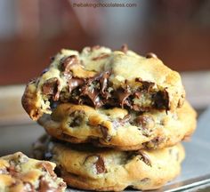 two chocolate chip cookies stacked on top of each other with the words perfect chocolate chip cookies