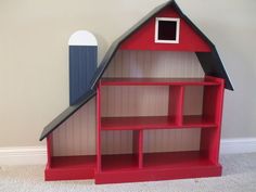 a red book shelf with a black roof