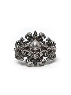 Introducing our exquisite Prince of Darkness Skull Ring perfect for those who love to add a touch of dark glamour to their look. This unique ring features a skeleton crucifix cross engrave into intricate wave pattern inspired by Art Nouveau style.  Crafted from high-quality sterling silver, this ring is the perfect choice for those who love to stand out from the crowd. The intricate detailing of the skulls and fangs is truly exquisite, adding a touch of macabre charm to the overall design. Wheth Gothic Metal Skull Ring, Gothic Silver Skull Ring, Gothic Skull Ring For Formal Occasions, Gothic Silver Jewelry With Skull Print, Gothic Skull Rings With Engraving, Gothic Skull Ring For Halloween, Gothic Silver Rings With Intricate Design, Formal Gothic Skull Ring, Gothic Sterling Silver Jewelry With Skull Print