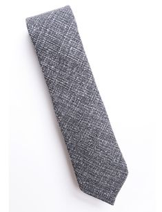 Our 'Standard Necktie' is made the right way - with a free-floating interlining and finished with a hand slip stitching and bar tack. The shape is slim, but not 'skinny'. They are also just a bit shorter than most ties, since we like them to hit just above the waistline, rather than below. DETAILS & CARE PATTERN & TEXTURE: This basketweave wool fabric has loads of texture. COLOR: "Ash" - Overall, a mid gray color. But, when you look closer, you'll notice a mix of lighter grays and very dark gray Fitted Standard Tie For Black Tie Events, Fitted Tie For Black Tie Events, Modern Fitted Black Suit And Tie Accessories, Elegant Wool Ties, Wool Tie, Shorts Sweatpants, Tuxedo Shirts, Suits For Sale, Texture Color