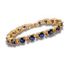 Add a touch of elegance to your jewellery collection with our Round Cut Swirl Blue Sapphire Bracelet, beautifully presented in a luxurious gift box. This stunning bracelet features mesmerizing round-cut blue sapphires set in an elegant swirl design, perfect for adding a sophisticated sparkle to any outfit. are Instructions: Avoid exposure to harsh chemicals and store it in the provided gift box when not in use to maintain its shine. Clean gently with a soft cloth to preserve the brilliance of th Elegant Cubic Zirconia Bracelet For Her, Blue Cubic Zirconia Bracelet Gift, Elegant Blue Party Bracelets, Elegant Sapphire Bracelets For Gift, Elegant Cubic Zirconia Bracelet With Birthstone, Elegant Sapphire Jewelry For Her, Elegant Blue Bracelets For Anniversary, Elegant Blue Bracelets For Formal Occasions, Elegant Formal Blue Bracelets