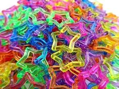 a pile of colorful plastic star shaped beads