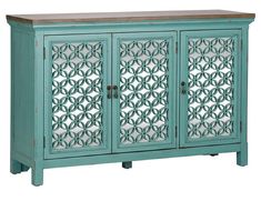 a blue cabinet with two doors and an intricate design