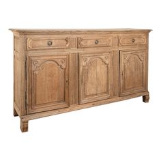 an old wooden sideboard with carvings on the doors and drawers, isolated against a white background