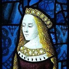 a stained glass window with a woman wearing a crown