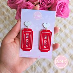 ️ PUCKER UP ❤️🎫✨ Get into the love-day spirit with our ADORABLE Valentine's Day themed earrings! Each pair is made lovingly by hand in my Melbourne studio using top quality acrylics sourced from fellow Aussie businesses  Our earrings are super lightweight and wear amazingly! Your ears won't have to suffer while you rock our stunning pieces 😍 Sizing: Each pair is sized at 2cm wide x 6.5cm tall (allow another .5cm for drop!) ✨ Find us on IG & Tiktok! @AMDMelbourne ✨ Red Heart-shaped Novelty Jewelry, Valentine's Day Heart-shaped Novelty Earrings, Fun Earrings For Mother's Day Gift, Valentine's Day Novelty Dangle Earrings, Novelty Red Earrings For Gift, Valentine's Day Novelty Dangle Jewelry, Novelty White Jewelry For Valentine's Day, White Novelty Jewelry For Valentine's Day, Red Novelty Jewelry For Birthday