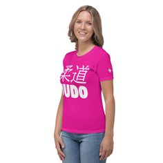 a woman wearing a pink t - shirt with the word oudo written in chinese