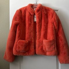 A Beautiful And Unique Bright Orange Faux Fur Jacket, Brand Nwt! Fully Lined. Front Pockets. Hook Closure. Measures 23 Inches Long And 19 Inches Across From Armpit To Armpit In The Back. Cold Weather Spring Fur Coat With Pockets, Spring Fur Coat For Cold Weather With Pockets, Fur Coat With Pockets For Cold Weather In Spring, Fitted Faux Fur Casual Outerwear, Spring Workwear Fur Coat With Faux Fur Lining, Spring Faux Fur Outerwear With Pockets, Spring Faux Fur Lined Outerwear For Work, Spring Workwear Outerwear With Faux Fur Lining, Faux Fur Jacket