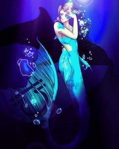 a woman in a blue dress standing next to a fish under the water with bubbles