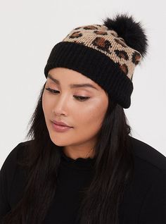 This purr-fectly soft beanie features a leopard print, black ribbed trim and a black faux fur pom-pom up top. Acrylic/polyester. Wash cold; dry flat. Imported. The best plus size women's leopard & black faux fur pom beanie beanies in multi. Torrid is your destination for cozy fall and winter clothes to keep you warm and comfortable. Black Faux Fur Hat For Fall, Casual Faux Fur Beanie Hat, Casual Faux Fur Beanie, Faux Fur Beanie Hats For Fall, Faux Fur Beanie For Fall, Fall Faux Fur Beanie Hat, Casual Winter Hat With Faux Fur Trim, Casual Fall Beanie With Pom Poms, Trendy Fall Hats With Faux Fur Lining