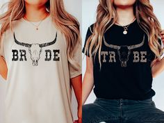 two women wearing tshirts that say bride and tr de with long horns on them