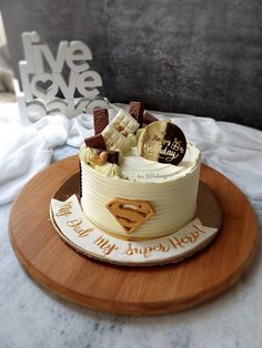 there is a cake that has been decorated with chocolates and candies on it