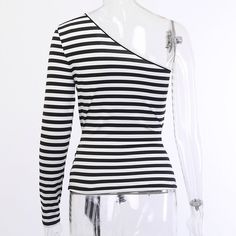 Material: COTTON Decoration: Hollow Out Pattern Type: Striped Sleeve Length(cm): Full Sleeve Style: REGULAR Model Number: 90419 Fabric Type: Broadcloth Collar: Asymmetrical Clothing Length: Short Style: Casual color: White,Black,Stripe season: Autumn style: Fashion,Casual,Streetwear Black Stretch One Shoulder Top With Long Sleeve, Black Stretch One Shoulder Top For Spring, Black Asymmetrical Cotton Top, Casual Black Stretch One-shoulder Top, Black Stretch Casual One Shoulder Top, Casual Tops With Asymmetrical Neckline For Spring, Casual Top With Asymmetrical Neckline For Spring, Fall Black One Shoulder Top, Spring Cotton Top With Asymmetrical Neckline