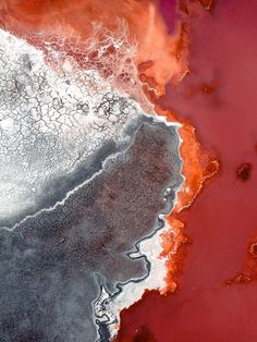 an aerial view of red and grey water