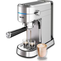 an espresso machine with two cups of coffee next to it on a white background