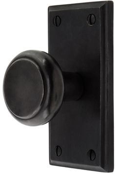 a black door handle with a round knob