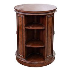 a round wooden table with shelves on the bottom and one shelf in the middle, against a white background