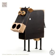 a wooden cow made to look like it is standing