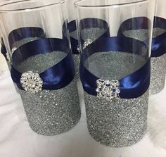 four wine glasses with blue bows on them