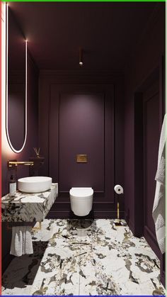 a bathroom with purple walls and marble counter tops