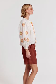 Our best-selling Minka Shirt has intricate embroidery in rich colors of the season. Loose, blousy, and in our crisp poplin.

 Rochelle Behrens reimagined how shirts should fit and feel. Our patented No Gape® button technology, seamlessly designed into every shirt and shirtdress we design, eliminates blouse gape. Finally say bye-bye blouse gape, and hello to The Shirt.

  
 * Imported 
 * 100% Cotton Orange Long Sleeve Blouse With Floral Embroidery, Orange Embroidered Cotton Blouse, Orange Cotton Blouse With Floral Embroidery, Long Sleeve Orange Top With Floral Embroidery, Orange Floral Embroidered Long Sleeve Top, Casual Orange Embroidered Blouse, Embroidered Orange Cotton Top, Orange Embroidered Cotton Top, Fall Cotton Blouse With Multicolor Embroidery