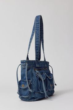 Y2K forever with this washed-soft denim tote bag from BDG. Oversized silhouette with a zippered top and tons of pockets at the outside. Find it only at Urban Outfitters. Features Carryall tote bag from BDG Soft denim with plenty of pockets Zip closure Shoulder strap Content 100% Cotton Machine wash Imported Size Dimensions: 12.99" l x 3.54" w x 8.26" h Strap drop: 12.99" | BDG Y2K Denim Tote Bag in Denim, Women's at Urban Outfitters On-the-go Denim Shoulder Bag With Zipper Pocket, Denim Tote Shoulder Bag With Zipper Closure, Denim Blue Hobo Bag With Pockets, Denim Hobo Tote Bag With Pockets, Denim Hobo Bag With Pockets For Travel, Denim Blue Hobo Bag For Travel, Denim Shoulder Hobo Bag With Pockets, Denim Hobo Shoulder Bag With Pockets, Denim Shoulder Bag With Pockets In Medium Wash