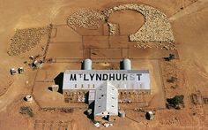 an aerial view of a factory in the desert