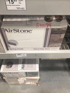 some boxes are stacked on top of each other in a store shelf with the same price tag