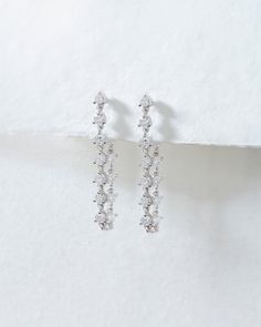 Our Diamond Ballier Studs are our unique take on a statement stud earring. They make the perfect diamond piece if you want a stud but also a hoop with their delicate design and subtle sparkle. Available in round-cut shape and crafted with ethical lab grown diamonds + the most precious metals, you'll never want to take them off. Diamond Linear Round Earrings As Gift, Luxury Linear Earrings With Single Cut Diamonds For Anniversary, Timeless Linear Earrings With Diamond Accents For Wedding, Dazzling Single Cut Diamond Drop Earrings, Minimalist Single Cut Diamond Earrings For Formal Occasions, Fine Jewelry Linear Diamond Earrings With Single Cut, Diamond Linear Earrings With Brilliant Cut For Gift, Diamond Linear Earrings With Diamond Accents Gift, Luxury Prong Set Linear Earrings For Anniversary