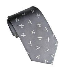 "- New to flying or love flying biplanes? Show your love of a new pilot with this necktie.  Note: We also carry two other airplane neckties featuring larger commercial planes (check our other listings) - High-end look & Feel -  Airplanes are embroidered onto fabric - Dark grey Background with light gray airplanes - Fabric has slight sheen - 100% microfiber     Perfect gift for Pilot, anyone going to flight school or in the Air Force! 100% Handmade - Our brand exclusive. Boutique level constructi Luxury Black Suit And Tie Accessories As Gift, Gifts For A Pilot, Pilot Bracelet, Pilot Gifts Teepublic, Airplane Fabric, Airplane Gifts, Airplane Cufflinks, Commercial Plane, Dark Grey Background