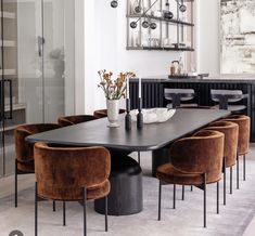 a dining room table with chairs around it