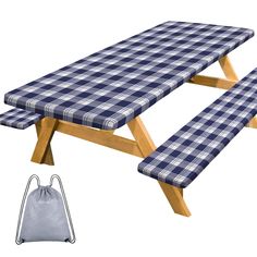 a blue and white checkered picnic table with a drawstring bag next to it