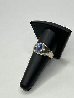 Vintage 14K White Gold Blue Star Sapphire & Diamond Men's Ring. This ring features an oval cut blue star sapphire stone measuring 8mm x 5.75mm (approximatemly 1.75 carats) and two round cut diamonds. The ring is a size 10 and weighs a total of 6.28 grams. Ring is tested and stamped 14k gold. This pre-owned vintage ring is in good condition and is ready to be worn! Ring is exactly as shown in photos. THIS ITEM WILL BE SHIPPED WITH INSURANCE Willing to answer any questions and send more pictures i Star Sapphire Stone, Blue Star Sapphire, Star Sapphire, Sapphire Stone, Men's Ring, Vintage Ring, Blue Star, Sapphire Diamond, Round Cut Diamond