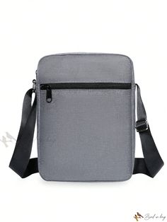 a gray bag with black straps on the front and back side, sitting against a white background