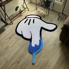 a living room with a rug that looks like a cartoon character